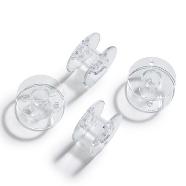 Sewing machine bobbins for horizontal looper